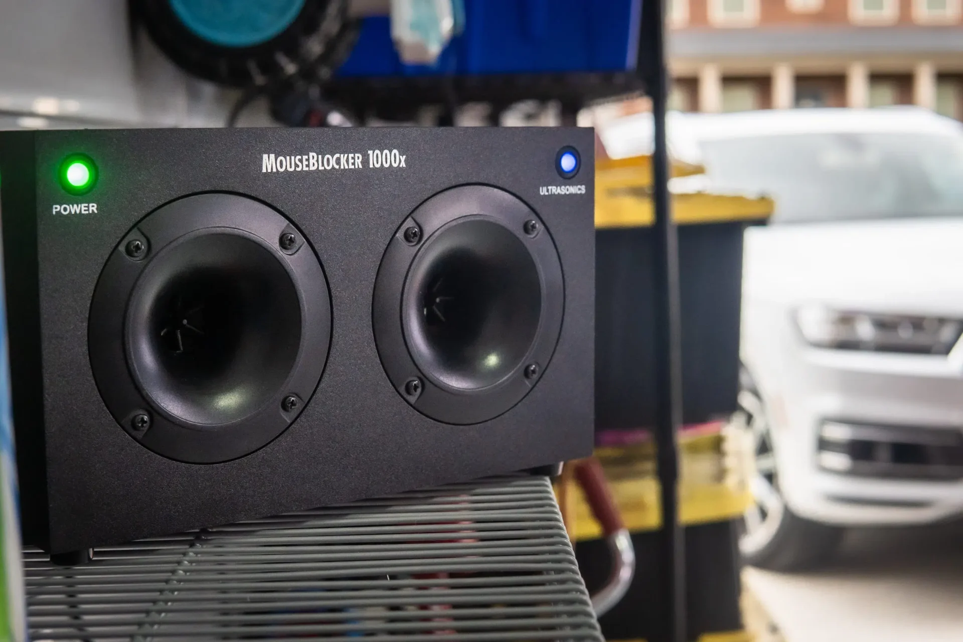 A black speaker sitting on top of a table.